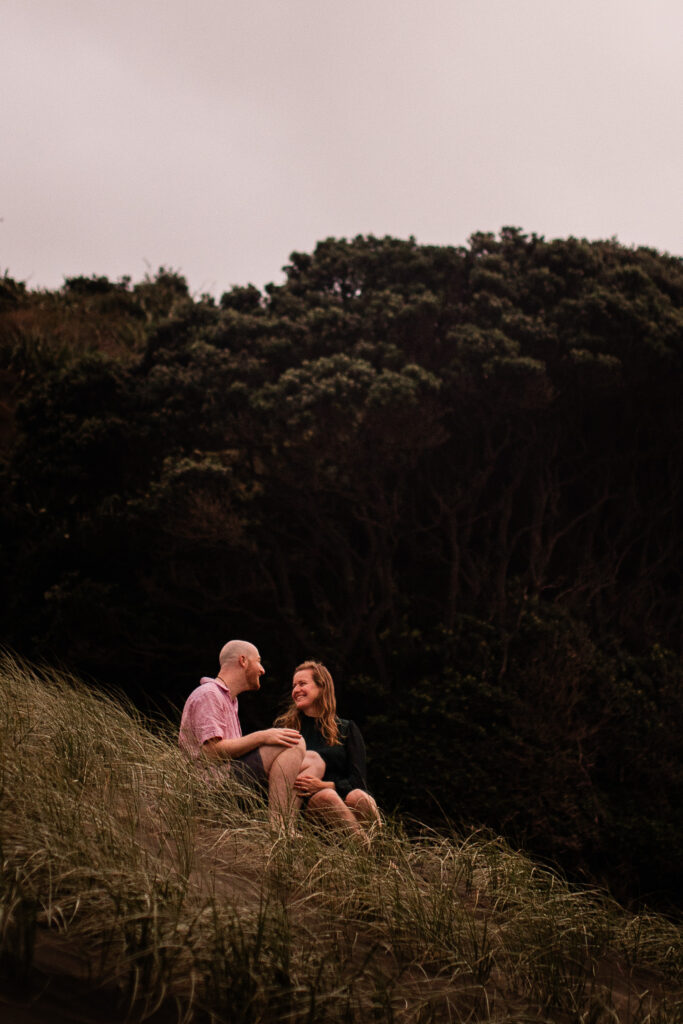 A romantic moment between a couple, during a beach pre-wedding shoot