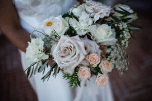 A luxury wedding floristry bouquet of roses and foliage
