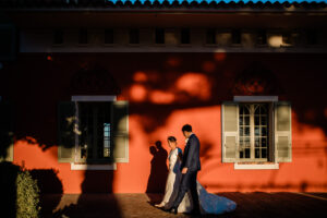 A documentary photography capture of a bride and groom during golden hour, taken by a destination wedding photographer