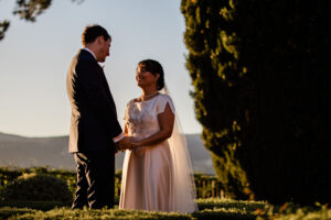 A romantic moment between a bride and groom during their French wedding, at golden hour
