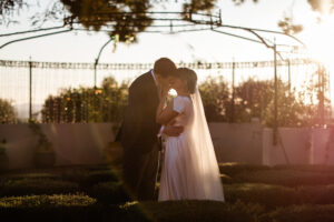 A documentary photography capture of a bride and groom during golden hour, taken by a destination wedding photographer