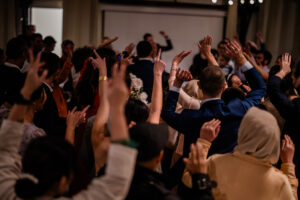 A documentary style capture of a spontaneous dance party during the wedding breakfast