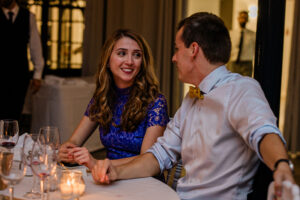 A candid moment between wedding guests