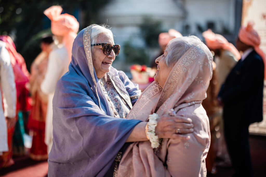 Documentary wedding photography of wedding guests during an Indian wedding, by a wedding photographer UK