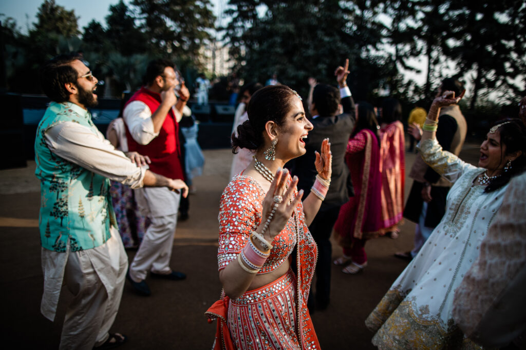 A bride dances during an Indian wedding reception in Chandigarh, captured by Laura Rosemary Photography