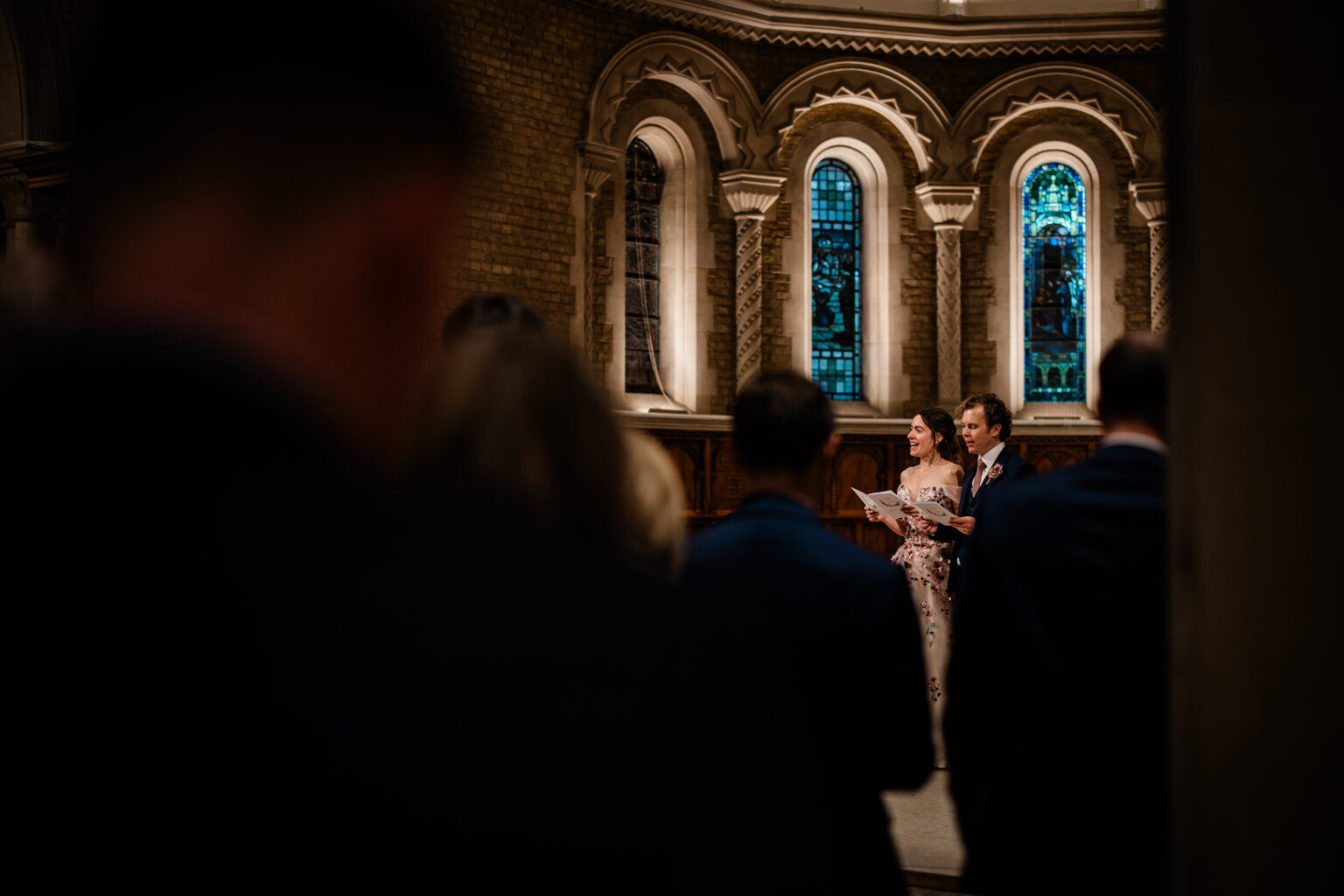 Candid wedding photos during the church wedding ceremony, in Oxford UK
