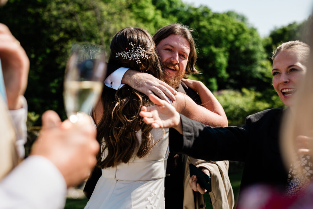 Documentary wedding photographer during a drinks reception in Sussex