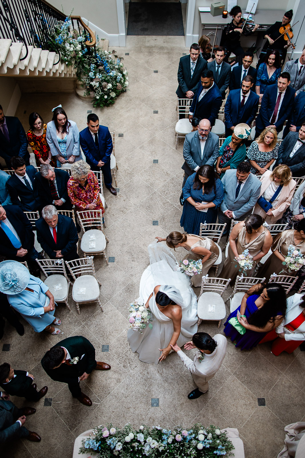 A bride walks down the aisle, at The Old Down Estate luxury wedding venue in Somerset