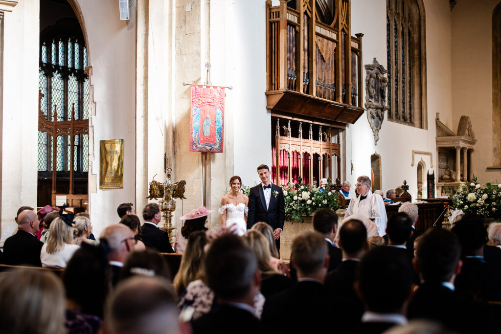 A bride and groom during their church ceremony in the Cotswolds