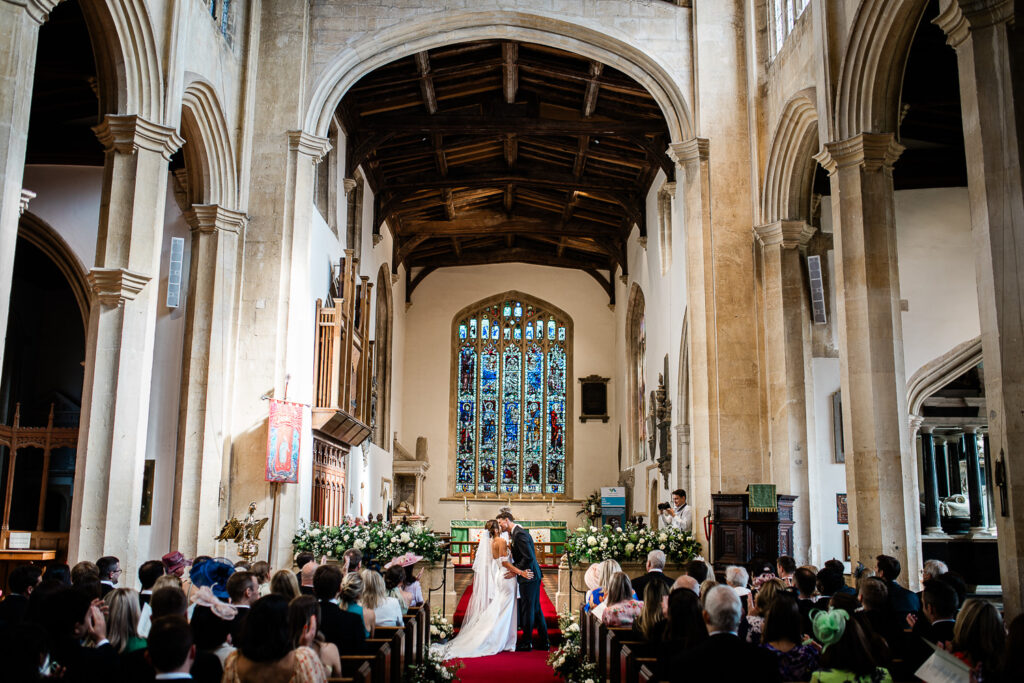 A bride and groom during their church ceremony in the Cotswolds