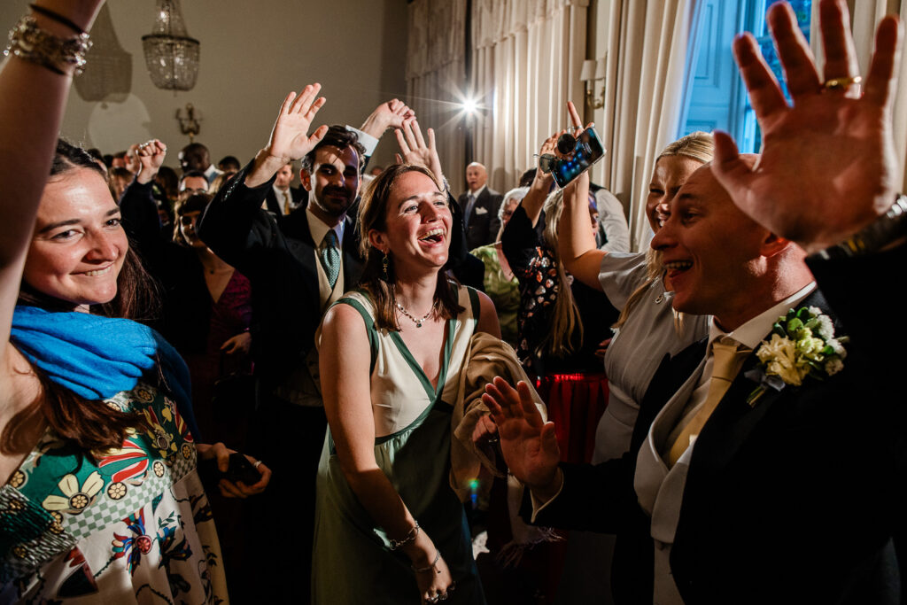 Evening celebrations captured by a wedding photographer at Pynes House