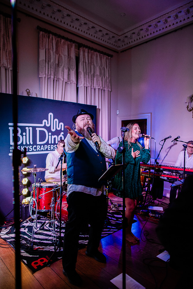 Candid wedding photography during dancing at Pynes House wedding venue