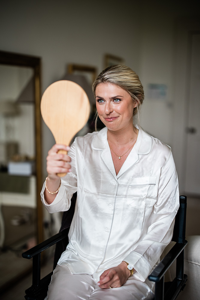 Candid morning preparations at Pynes House, captured by a documentary wedding photographer at Pynes House