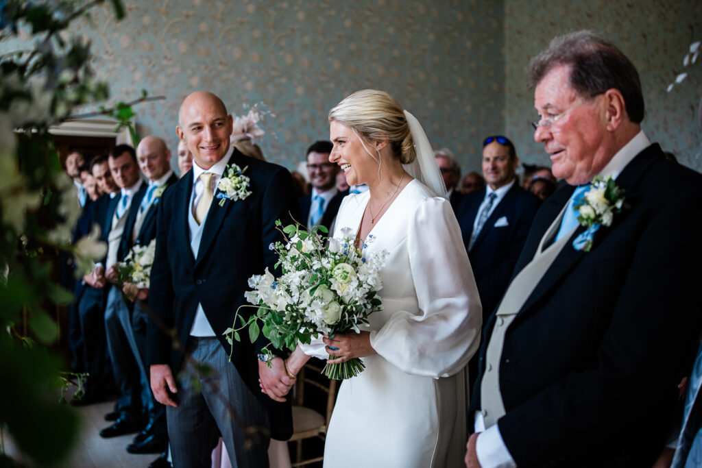 Documentary wedding photography during ceremony at Pynes House