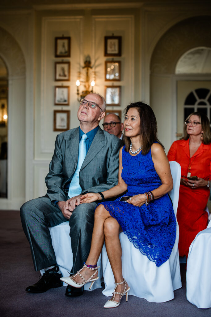 Documentary wedding photography of guests during the ceremony