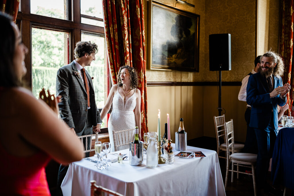 a bride and groom door their wedding speech, at a country house wedding venue in devon