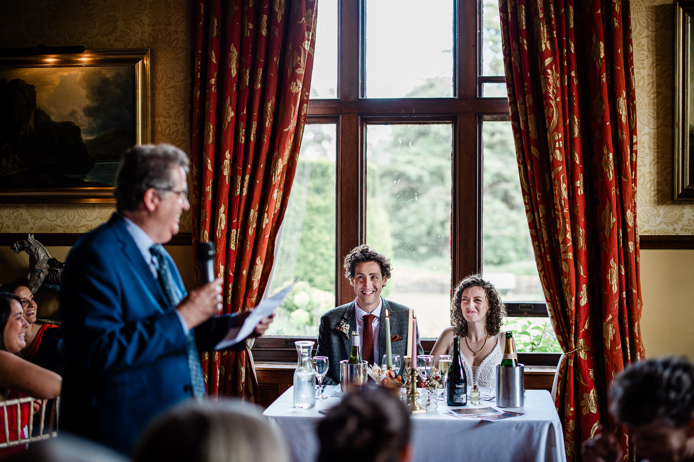 documentary capture of the wedding speeches captured by a wedding photographer at huntsham court