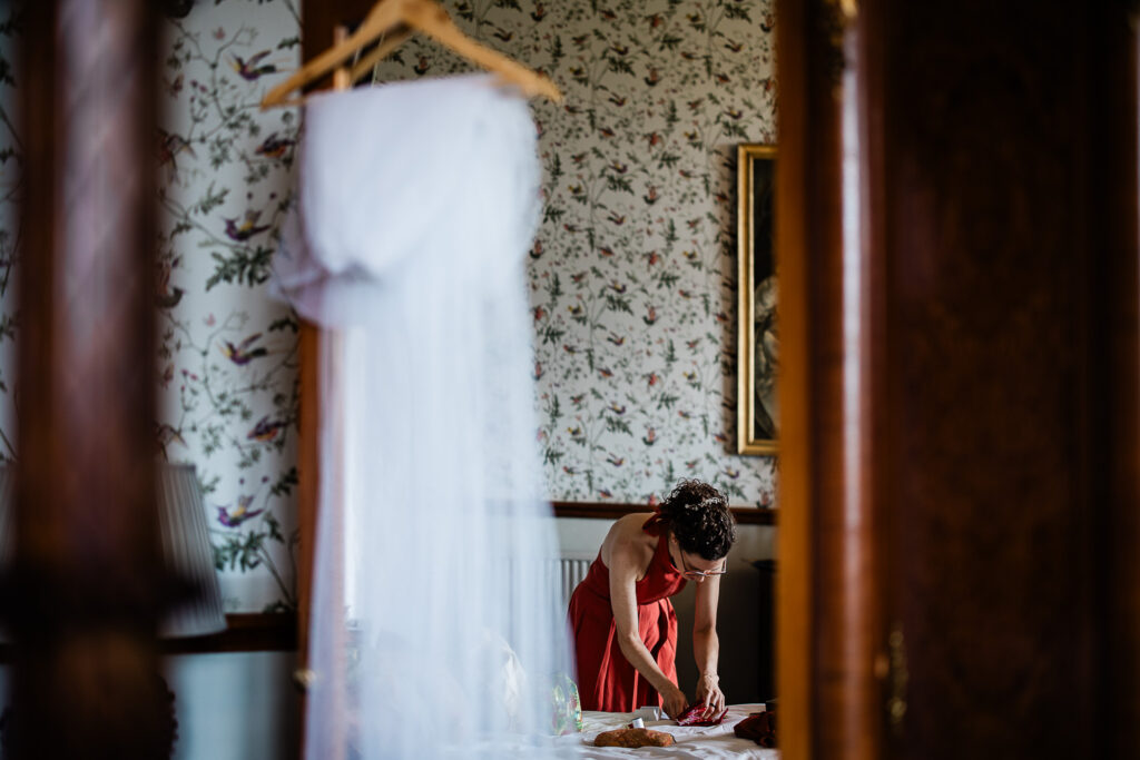 candid bridal preparations at a manor house wedding venue