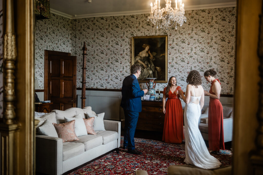 a friend smiles at the bride, before the ceremony