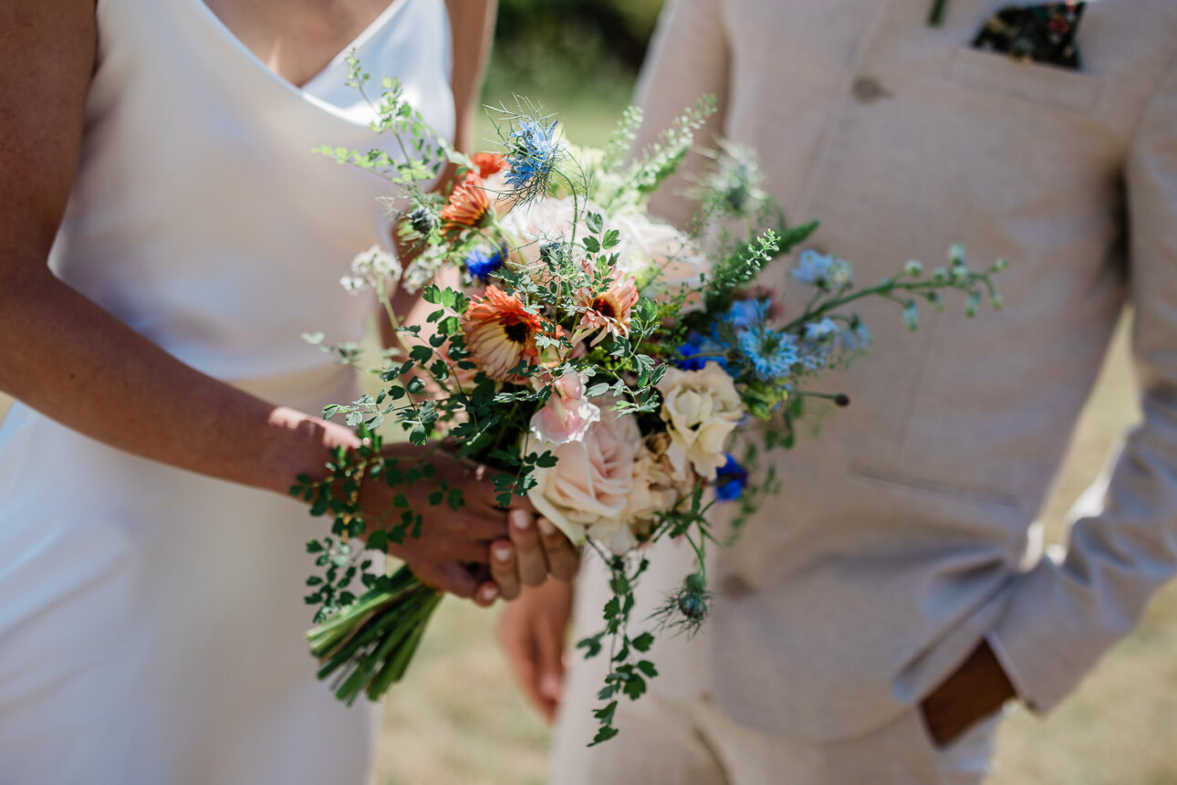 A bouquet of bright, summertime florals for a seaside barn wedding.