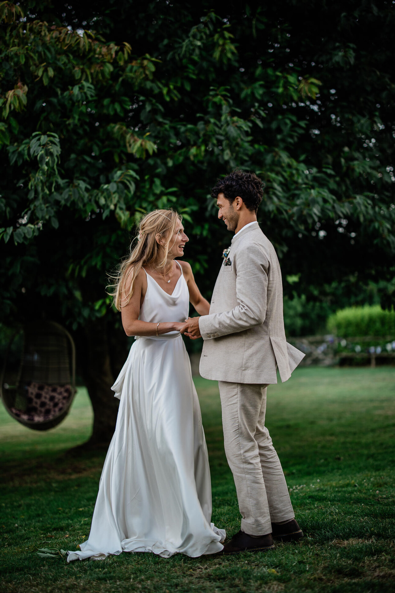 A bride and groom practise their first dance during a portrait session at The Grain Store wedding location.