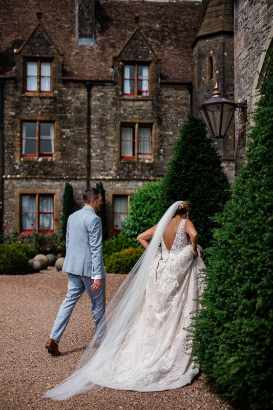 A newly wed couple exchange conversation as they enter a romantic, historical manor house in Devon.