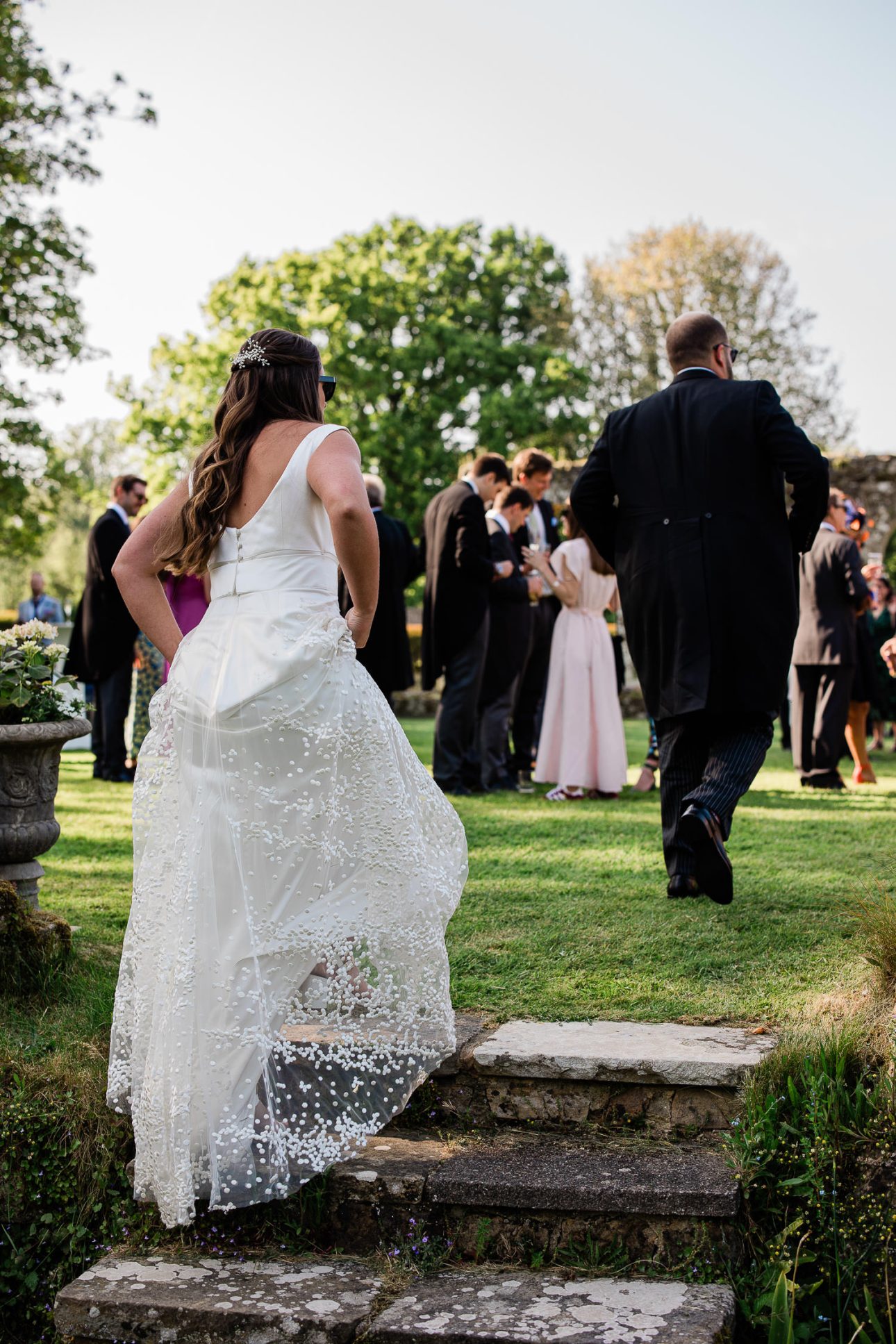Newly weds return to the wedding reception, after an evening wedding portrait shoot in the spring.