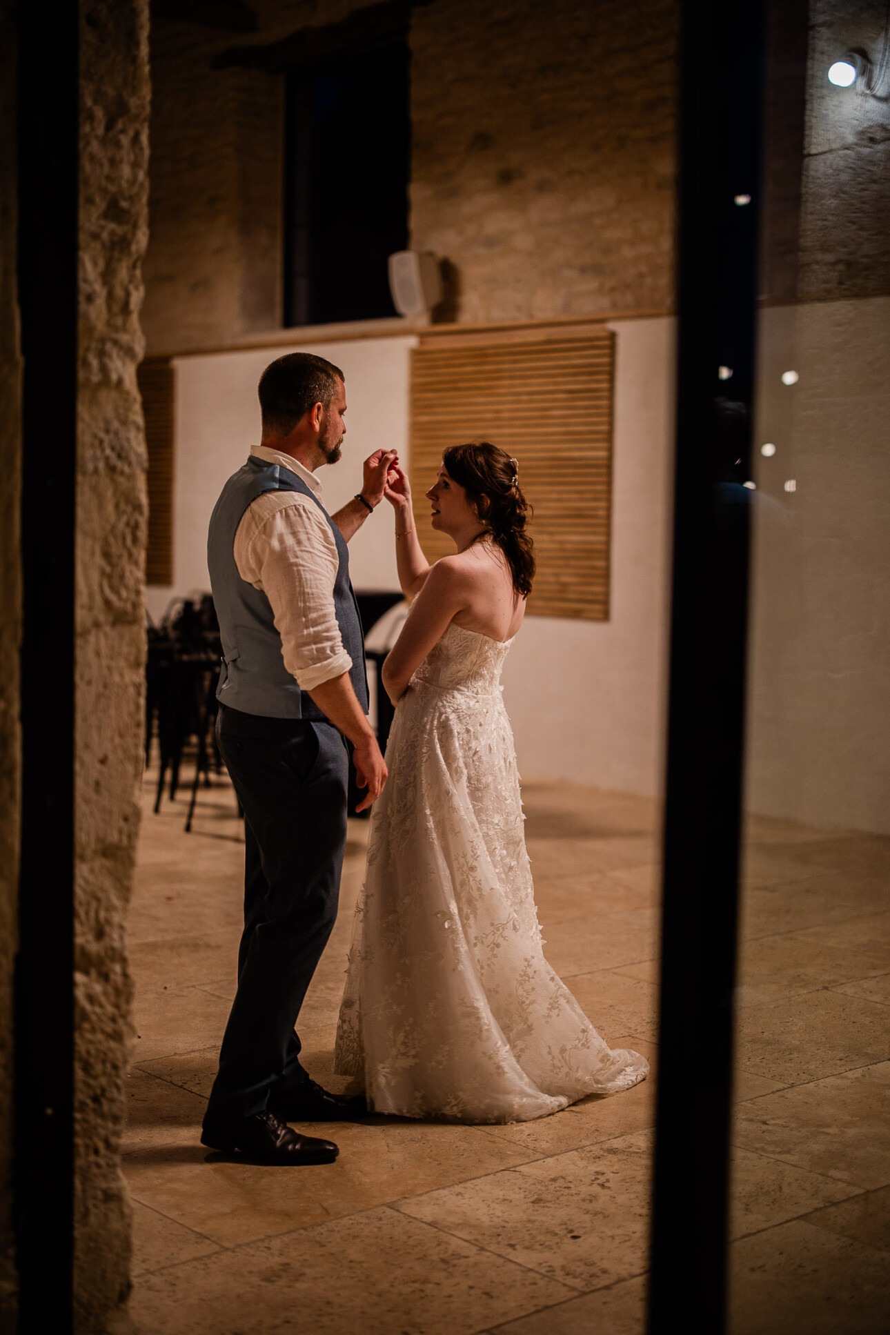 A bride and groom practise their first dance, before showing it to guests.
