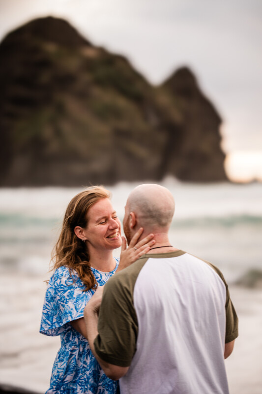 A romantic moment between a young couple on a beach