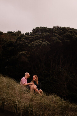 A romantic moment between a couple, during a beach pre-wedding shoot