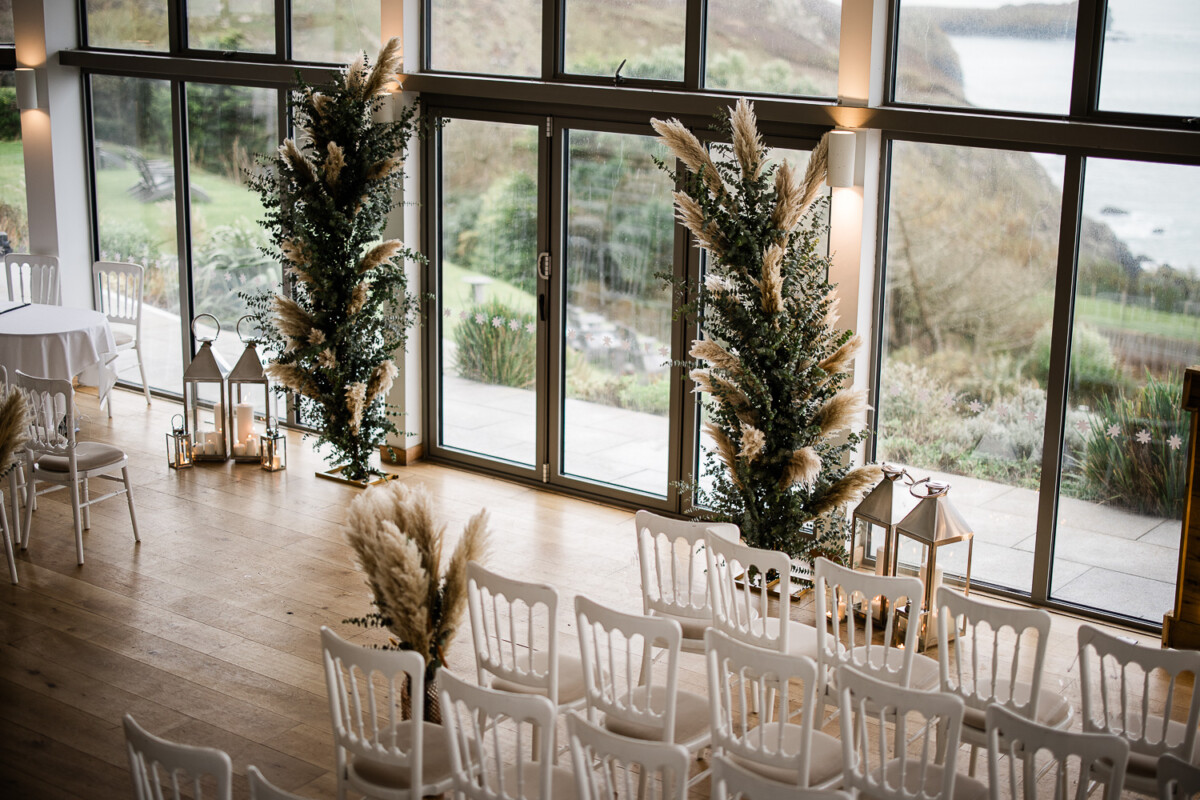 A rustic themed wedding ceremony by the sea