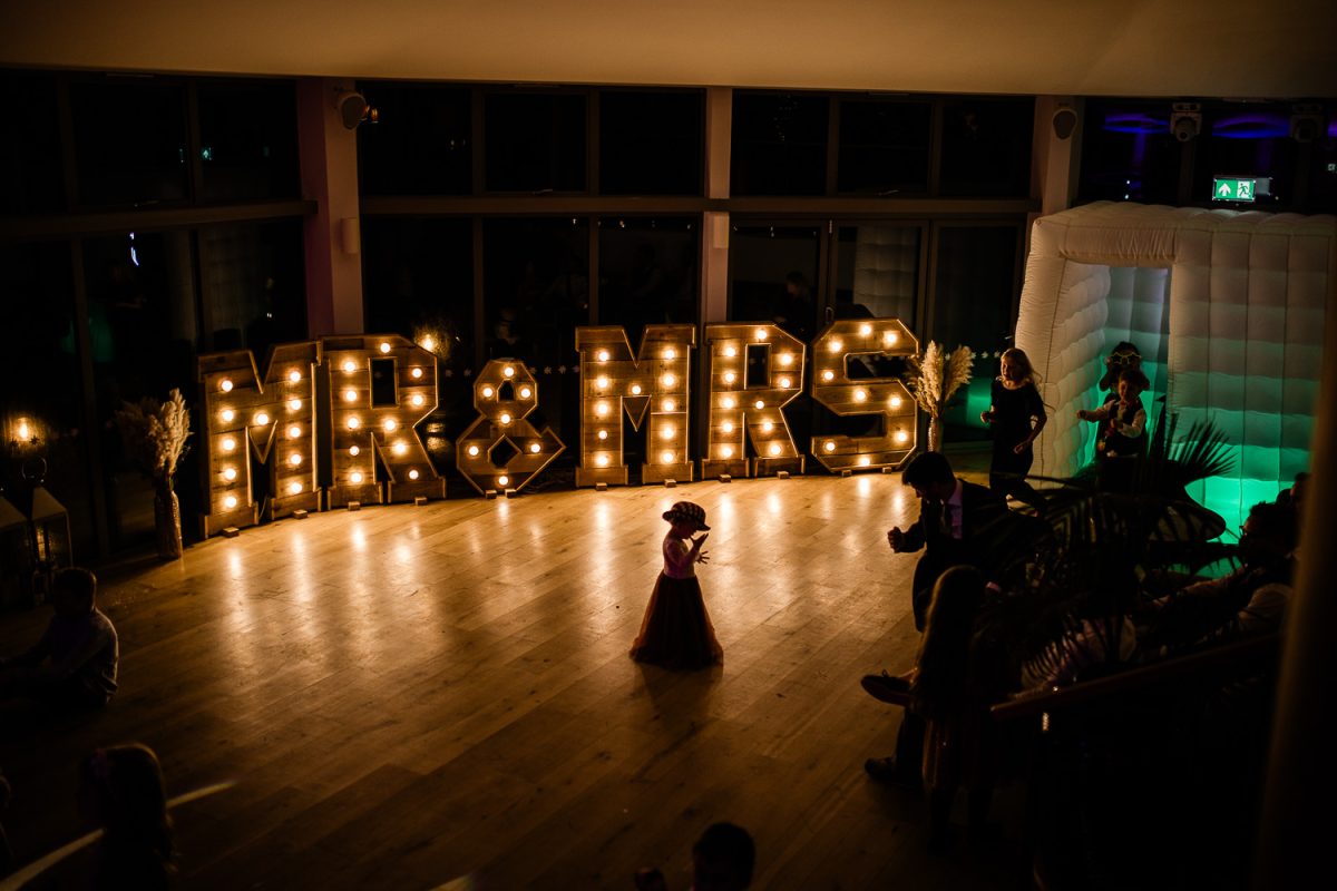 A girl dances alone on a dancefloor, for a Polurrian on the lizard wedding