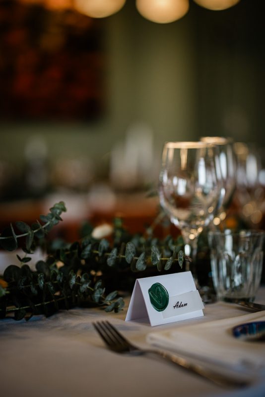 A place setting at an autumnal wedding reception, captured by a polurrian on the lizard wedding photographer