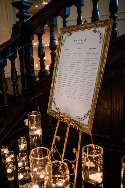 A table plan with candles for a black tie wedding at Brympton House