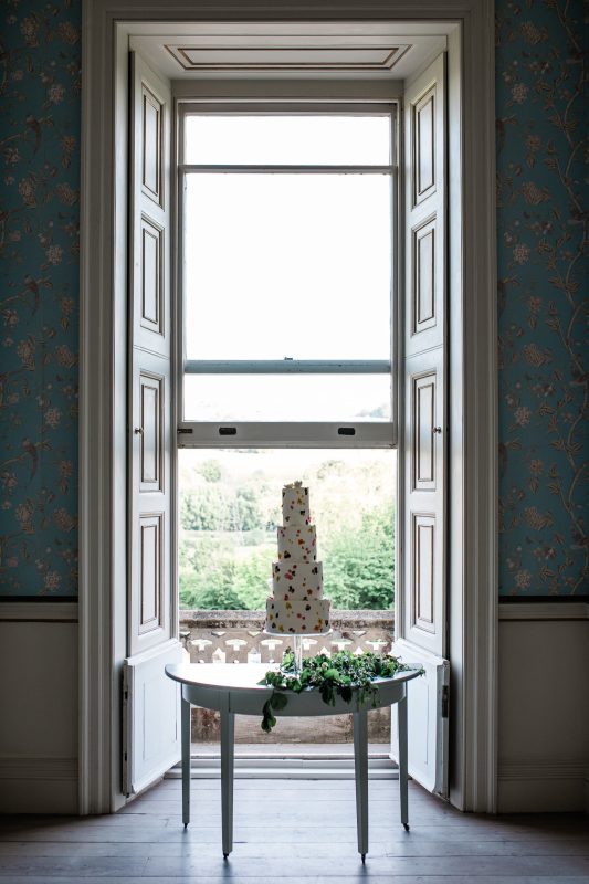 A cake table at Pynes House, a south west wedding venue in Devon