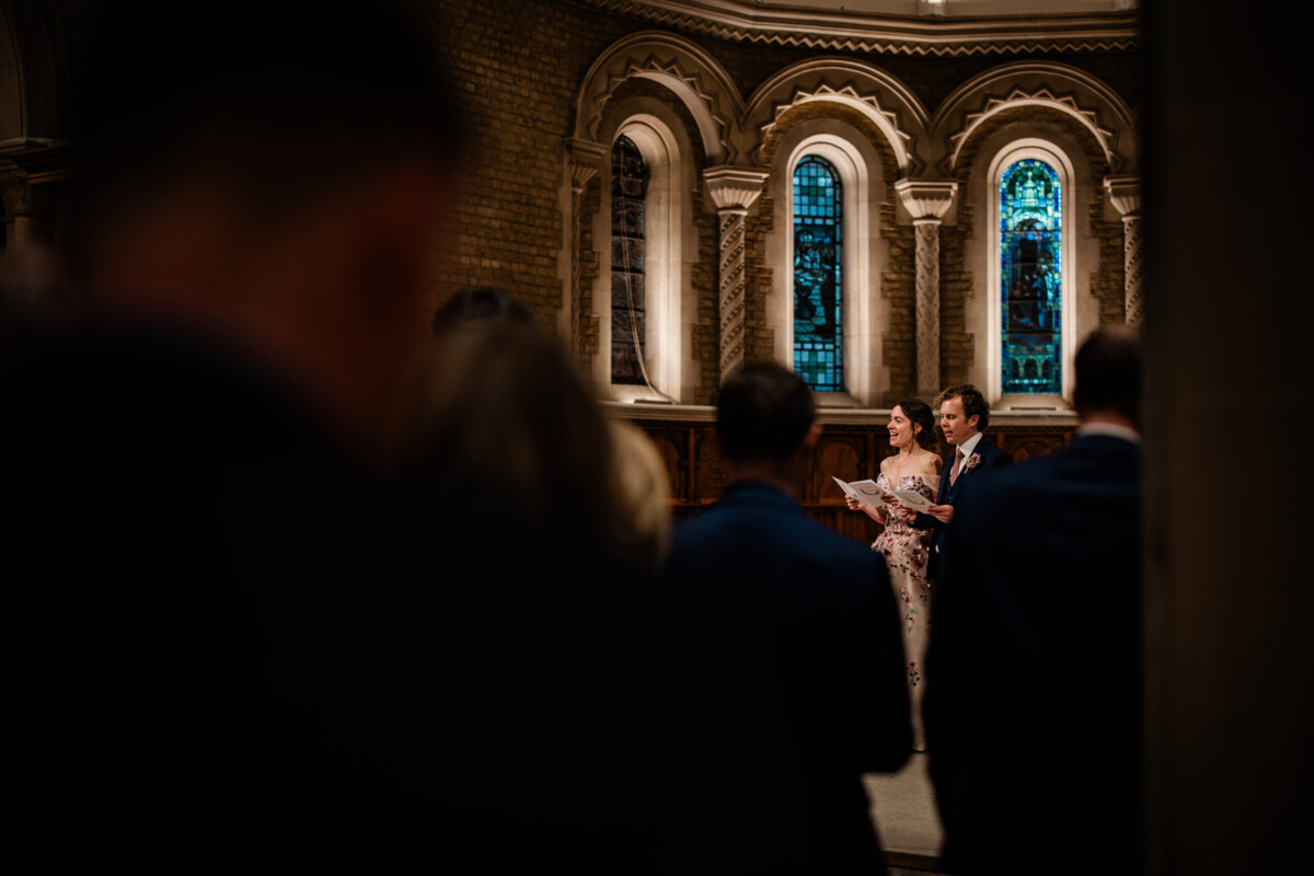 Candid wedding photos during the church wedding ceremony, in Oxford UK