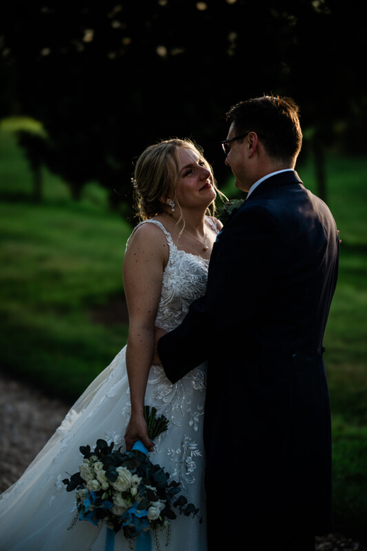 Candid couple photos of a bride and groom at golden hour, during a wedding at Pynes House