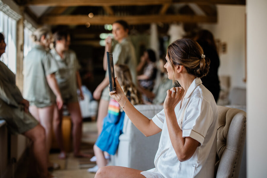 The bride prepares for her wedding ceremony at norton grounds in the cotswolds