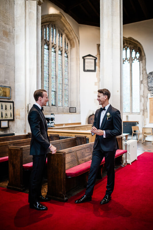 Candid captures by a Cotswolds wedding photographer, in Chipping Norton church