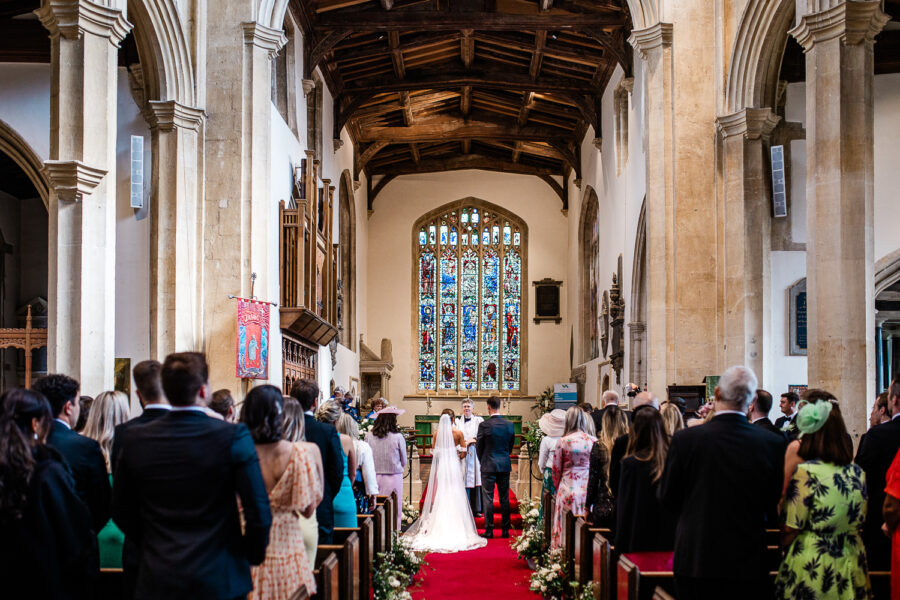 A bride and groom during their church ceremony in the Cotswolds
