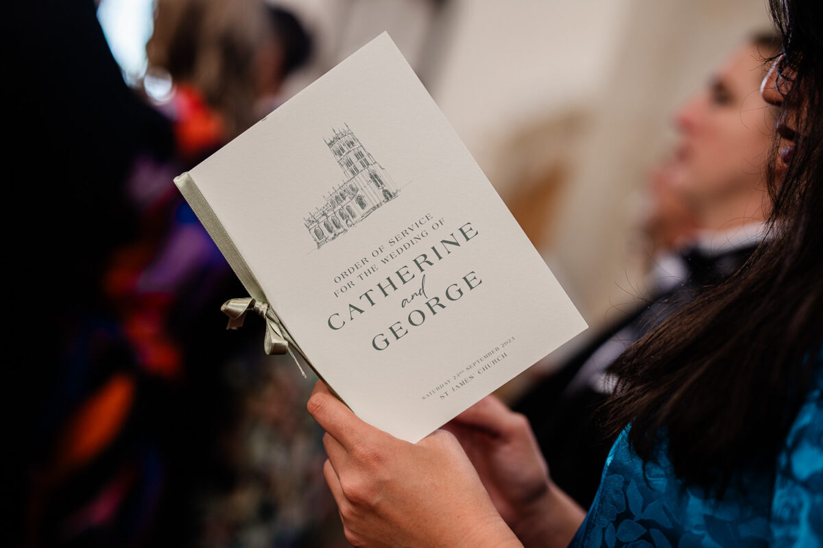 Candid Cotswolds wedding photography of guests during a wedding ceremony