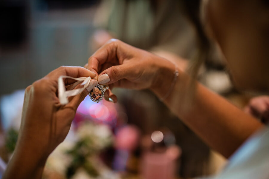 the bride prepares for her wedding ceremony at norton grounds in the cotswolds