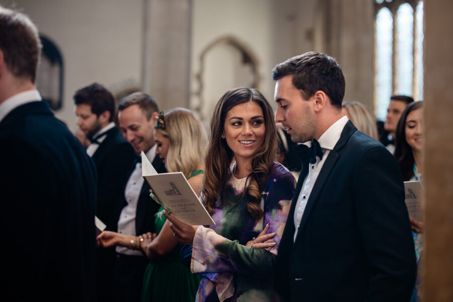 Candid Cotswolds documentary wedding photography of guests during a wedding ceremony