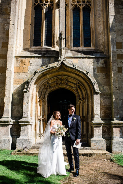 Documentary wedding photographer Cotswolds capture of a bride and groom at Chipping Norton church