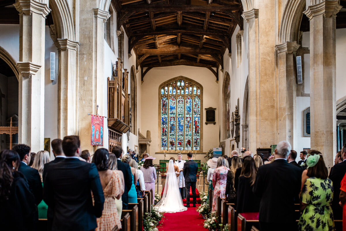 A bride and groom during their church ceremony in the Cotswolds