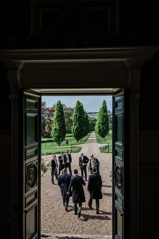 Candid captures during groom prep at Pynes House wedding venue in Devon