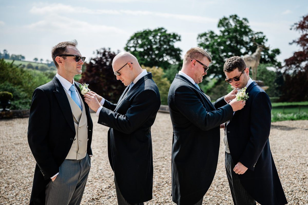Natural groom preparation photography by Laura Rosemary Photography