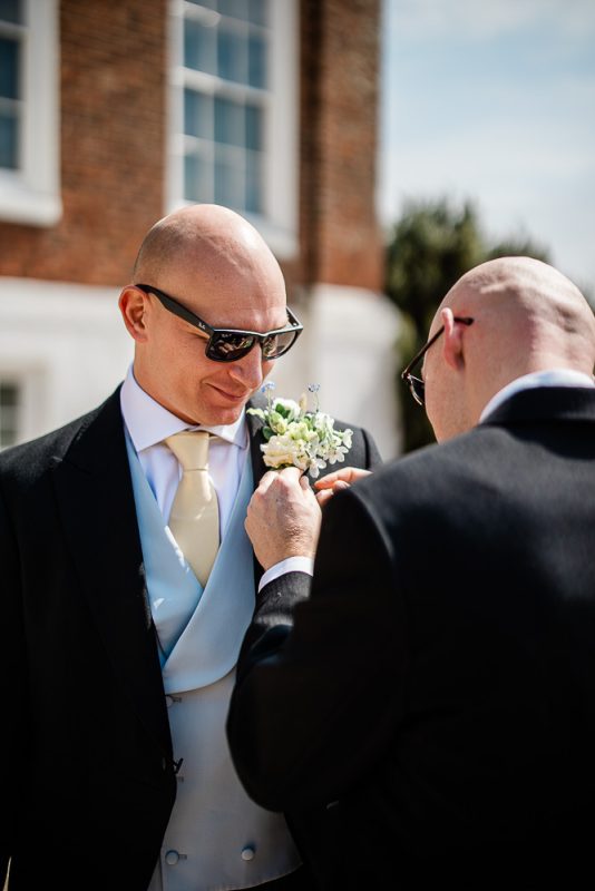 Natural groom preparation photography by Laura Rosemary Photography
