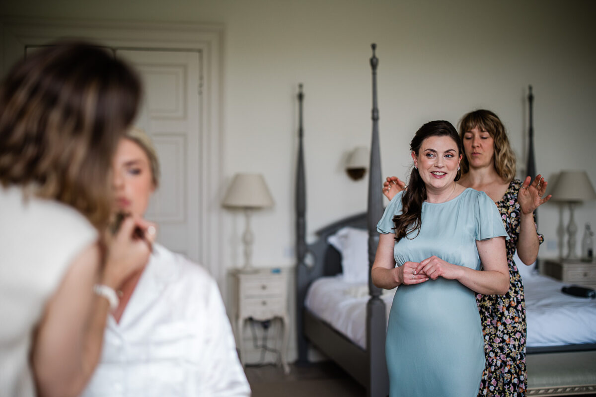 Candid morning preparations at Pynes House, captured by a documentary wedding photographer at Pynes House