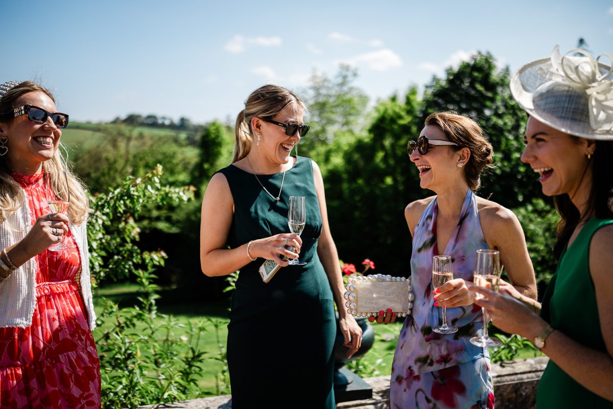 Outdoor wedding reception captured by wedding photographer at Pynes House